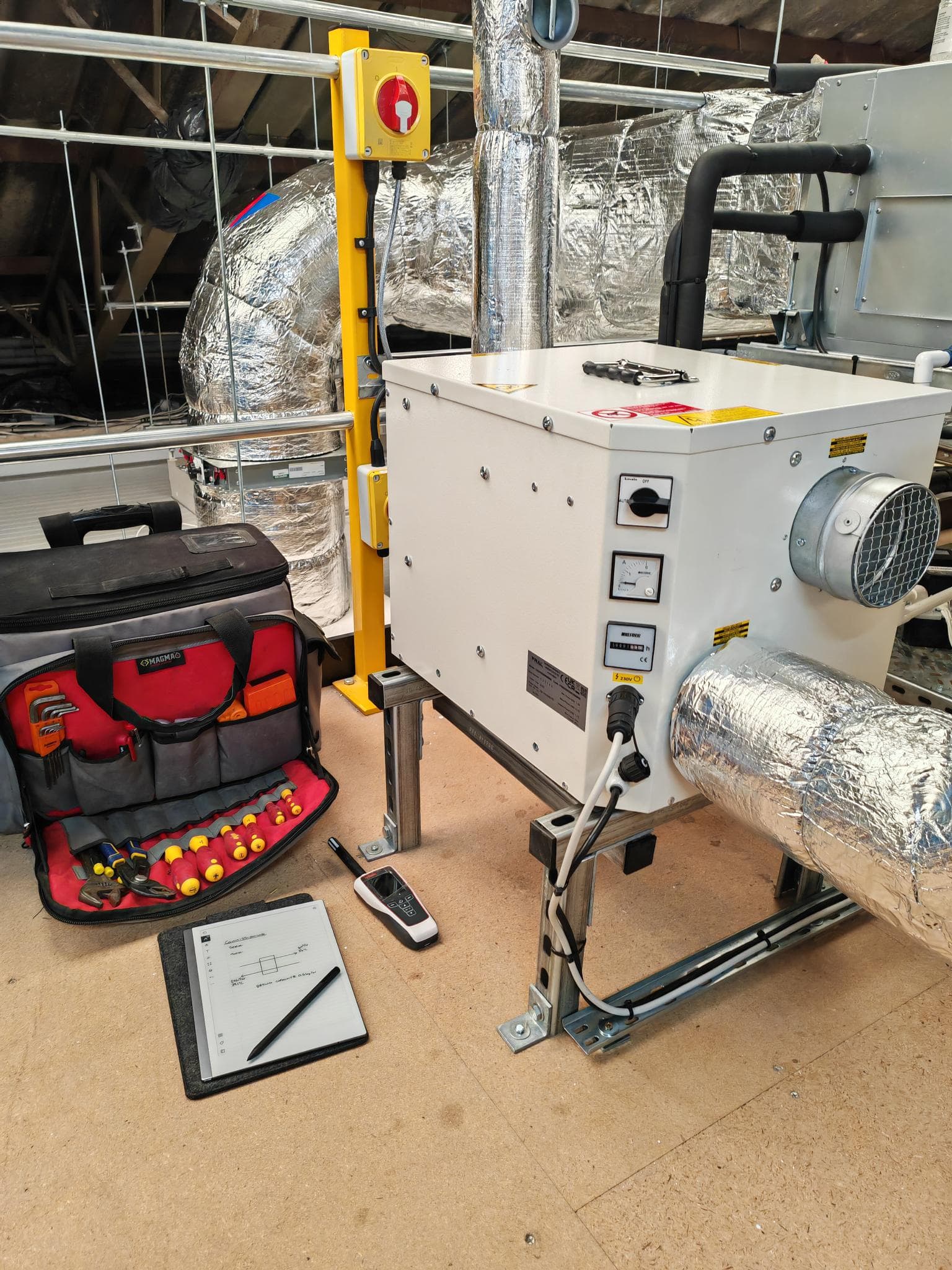 FRALUK engineer servicing a small desiccant dehumidifier unit